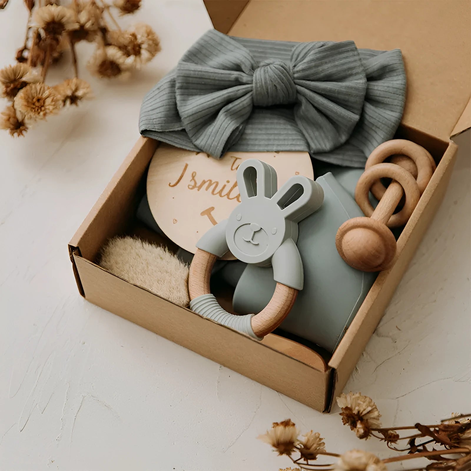 Newborn baby shower toy set with six bath toys in blue, peach, and brown options on a plain background