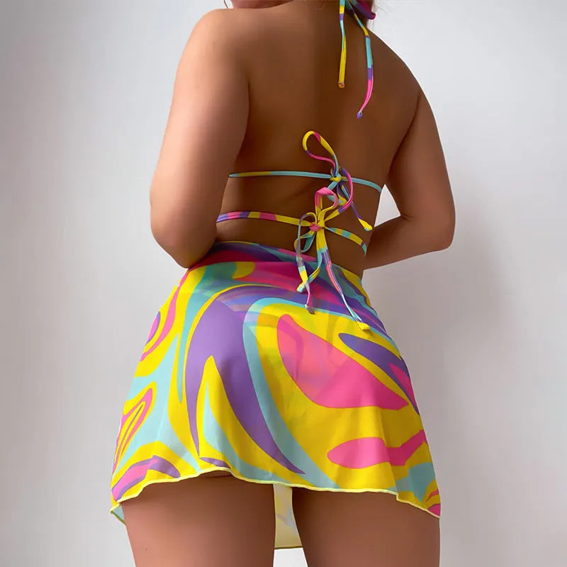 Yellow striped halter-neck swimsuit set for women with lace-up back, skirt, and shorts