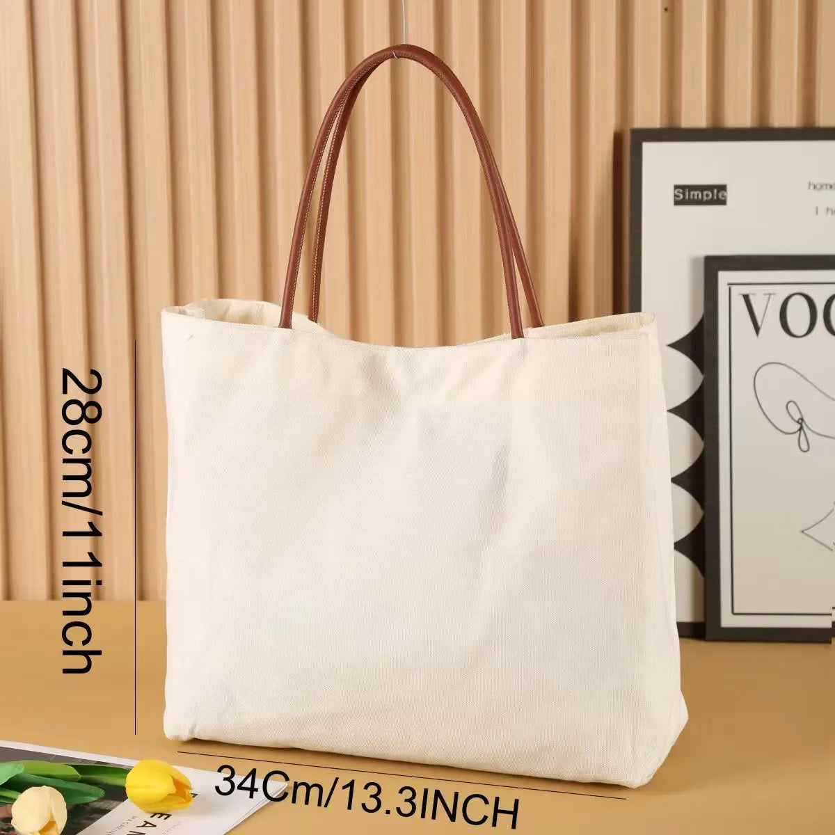 Beige white canvas tote bag with long handles and a front view showing its structured shape