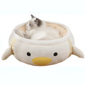 Green dinosaur and chick shaped cat bed shown both flat and hanging as a hammock.