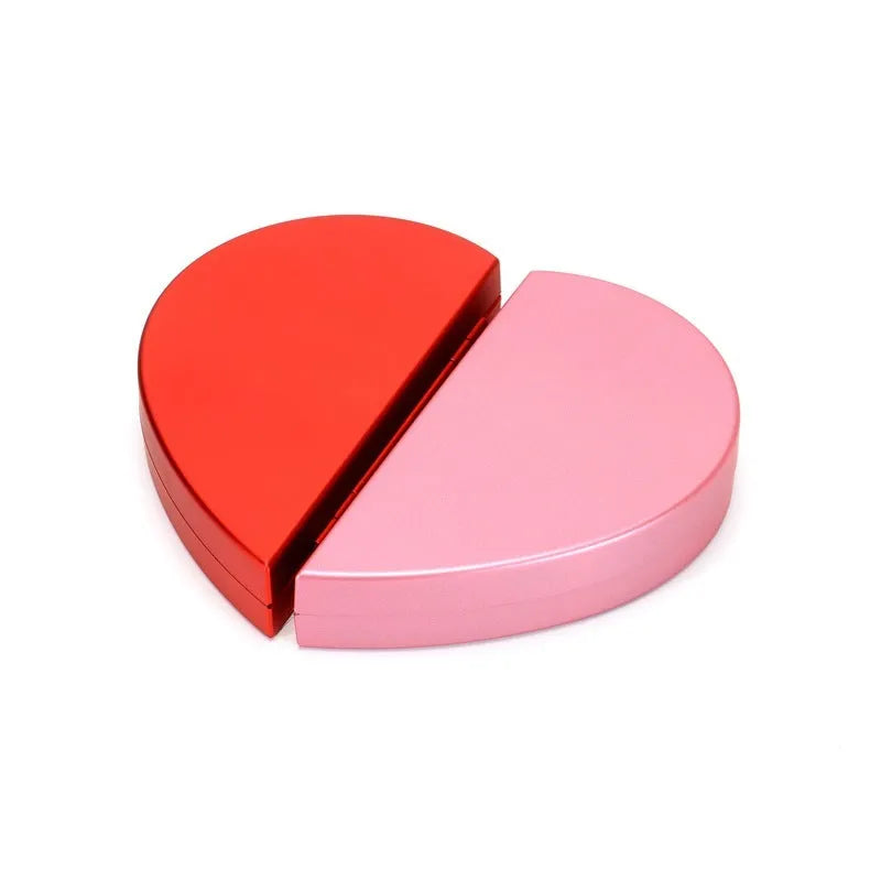 Red heart-shaped rotating ring box with 3D white rose decoration on top.