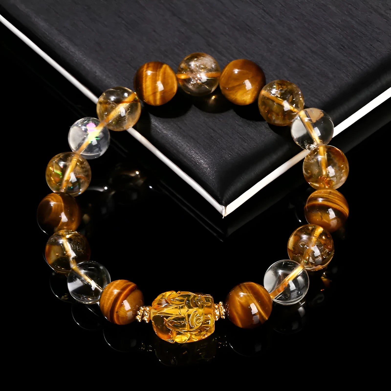 5A natural yellow tiger's eye and citrine bracelet with 10mm geometric beads and a beeswax pi xiu charm.
