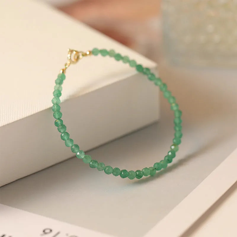 Handmade women's jade bracelet with 3mm beads in green aventurine, shown in 15cm length.