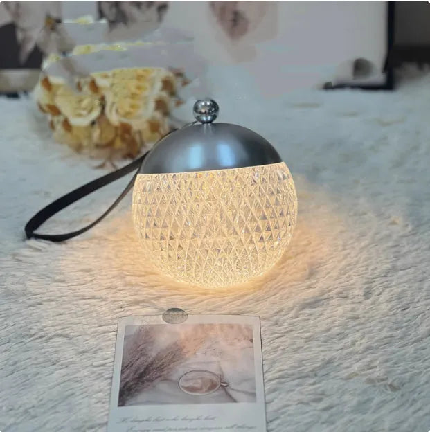 Portable touch dimmable LED desk lamp in chrome colour with 12cm diameter minimalist design