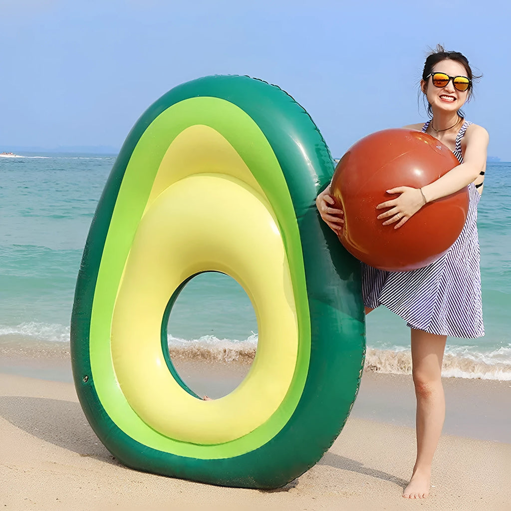 Green inflatable giant avocado pool float on water, showing its large 169x130cm size and smooth surface.