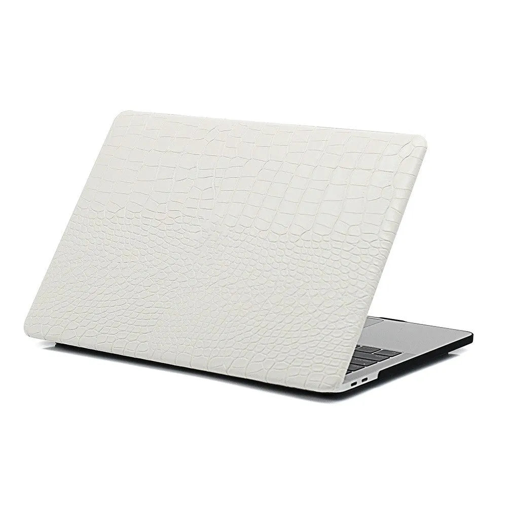 MacBook laptop case in soft pink with a textured crocodile pattern and a hollowed-out Apple logo on the lid.