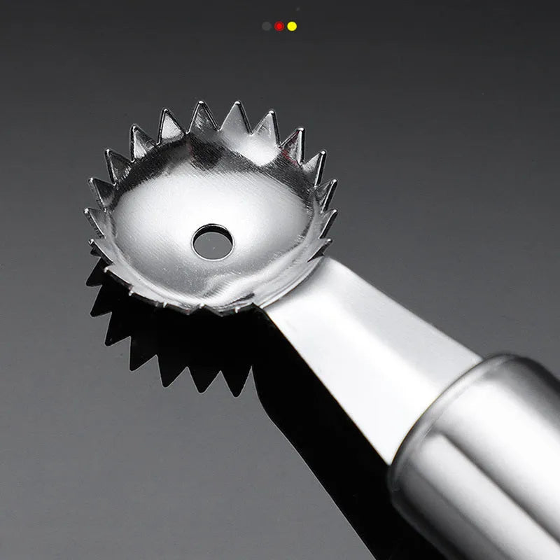 Stainless steel strawberry stem remover on a kitchen counter, modern minimalist design for coring fruit