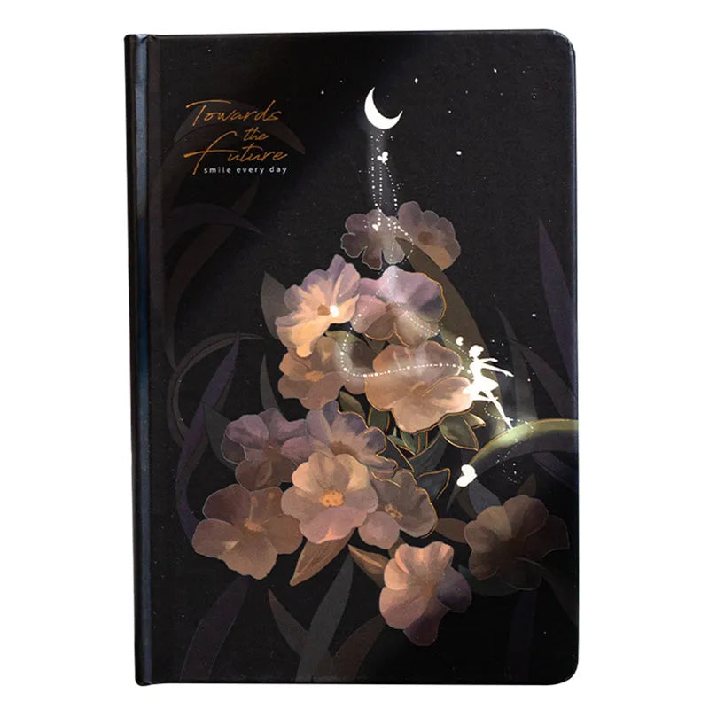 A5 notebook with luminous cover open to show pages filled with colour illustrations.