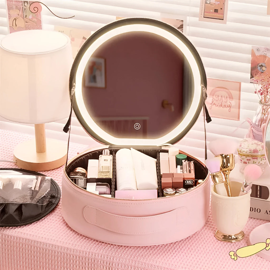 Round pink PU leather makeup bag open showing illuminated mirror and internal partitions.