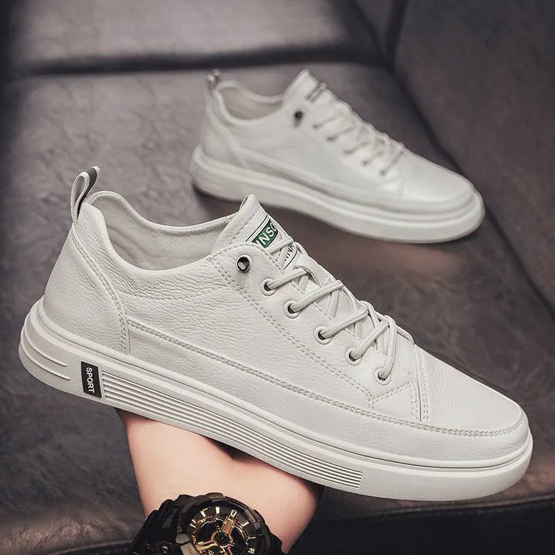 Men's casual white flat shoes with round toe and shallow mouth design on a plain background