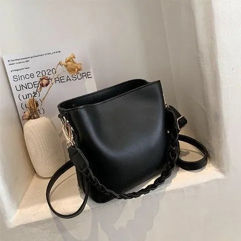 Khaki women's crossbody bucket bag with woven front texture and adjustable long strap