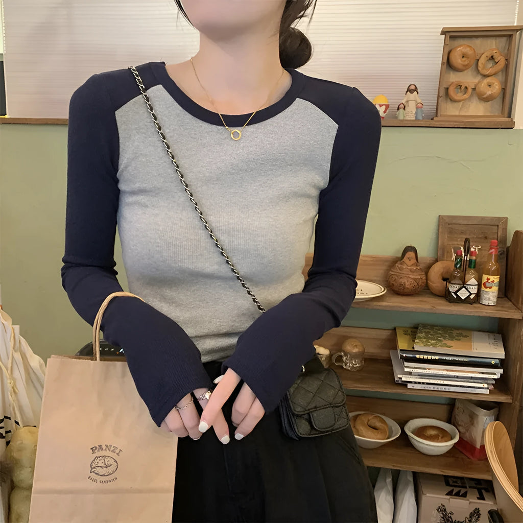 Women's oversized viscose top with long ruffled princess sleeves in dark blue.