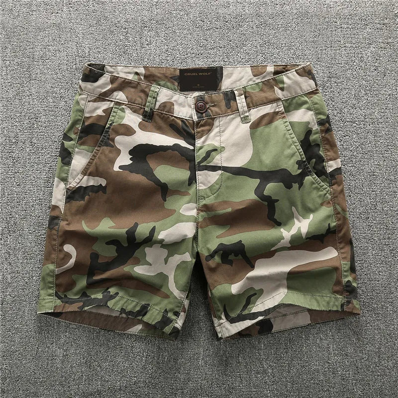 Men's green camouflage cotton workwear shorts with mid-waist design and zip fly placket