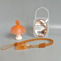 Small pink mushroom-shaped chew toy with transparent storage box and silver nano chain on a white background.