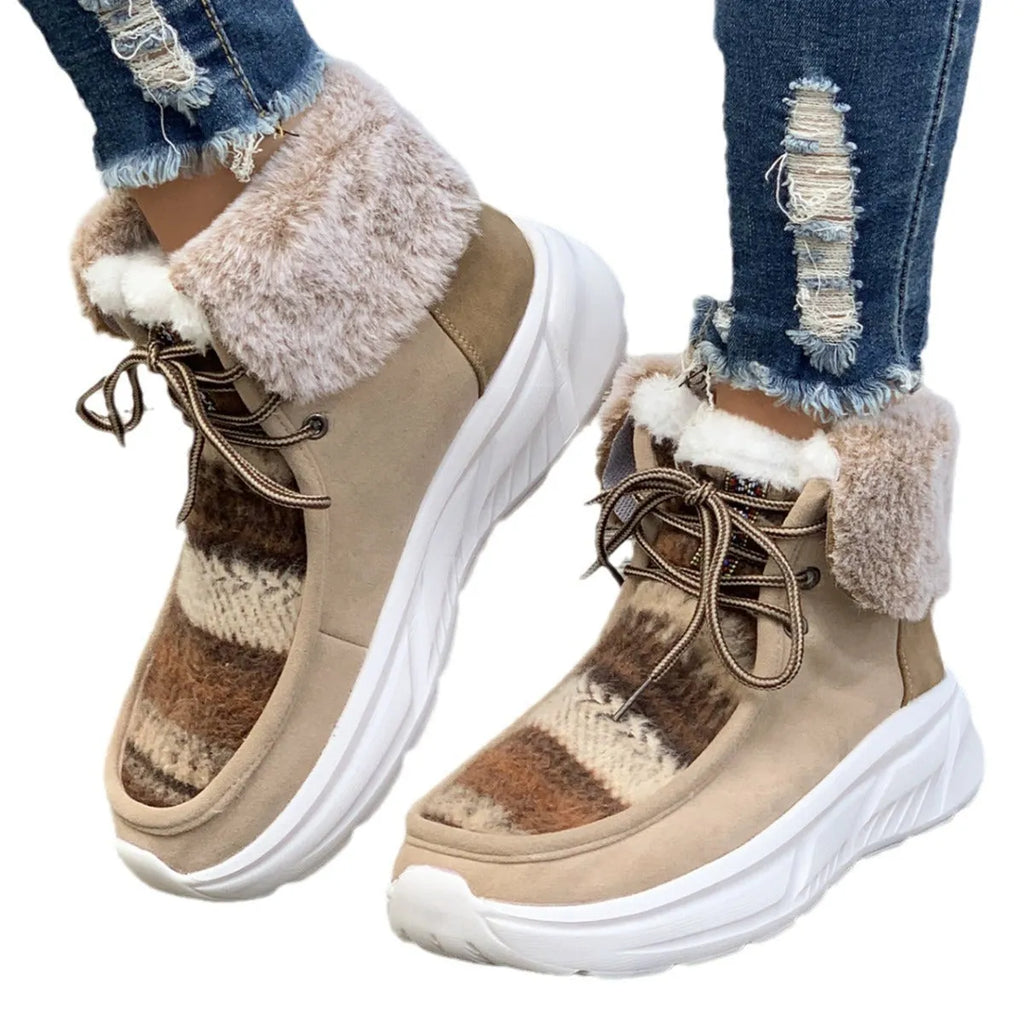 Women's beige lace-up suede snow boots with fuzzy lining and a thick non-slip rubber sole.