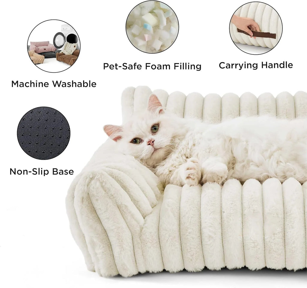 Beige corduroy cat couch with high backrest for pet support on a wooden floor.