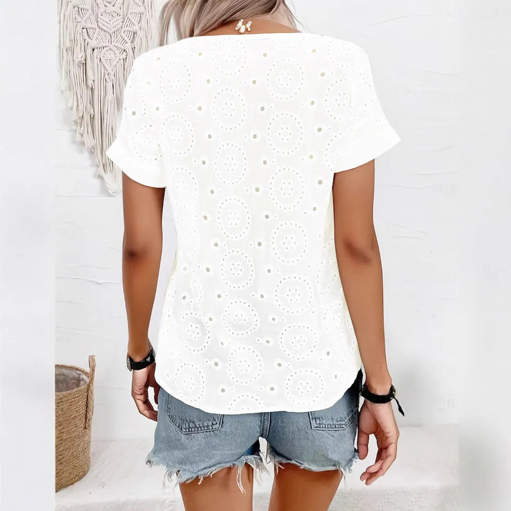 White women's oversized V-neck T-shirt with hollow-out lace detail on chest, short sleeves, loose fit.