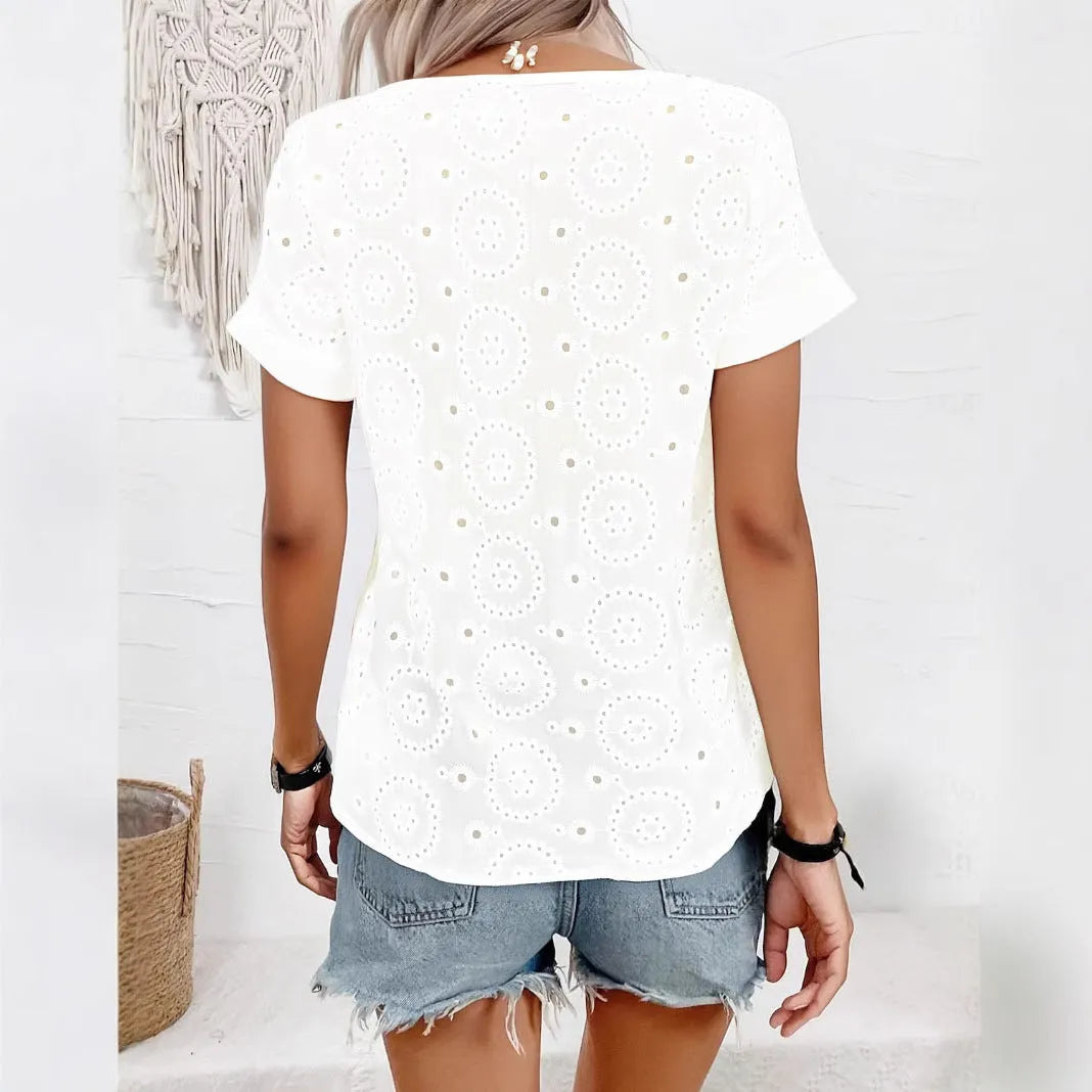 White women's oversized V-neck T-shirt with hollow-out lace detail on chest, short sleeves, loose fit.