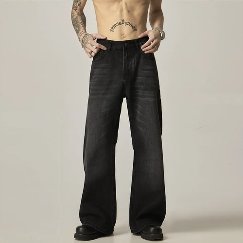 Black American retro loose straight jeans with zip fly opening on denim background