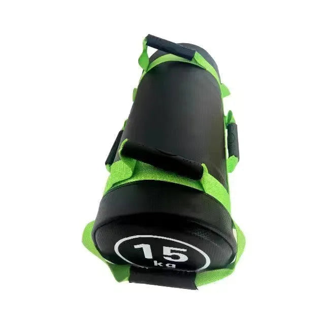 Flat white PVC fitness sandbag on gym floor, showing size and sturdy handles for weight training.