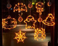 Halloween window hanging LED lights set with seven battery-powered horror-themed decorative pieces