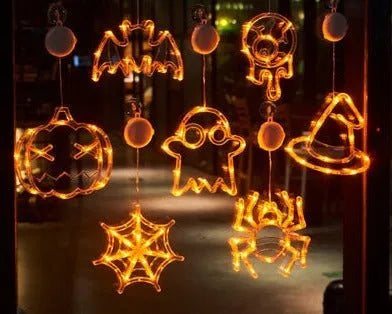 Halloween window hanging LED lights set with seven battery-powered horror-themed decorative pieces