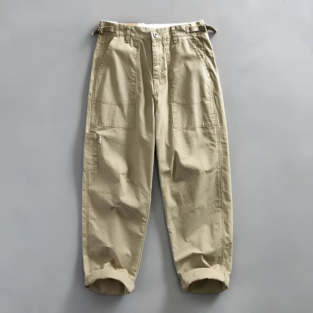 Men's straight fit cotton casual trousers in apricot, shown on a hanger.