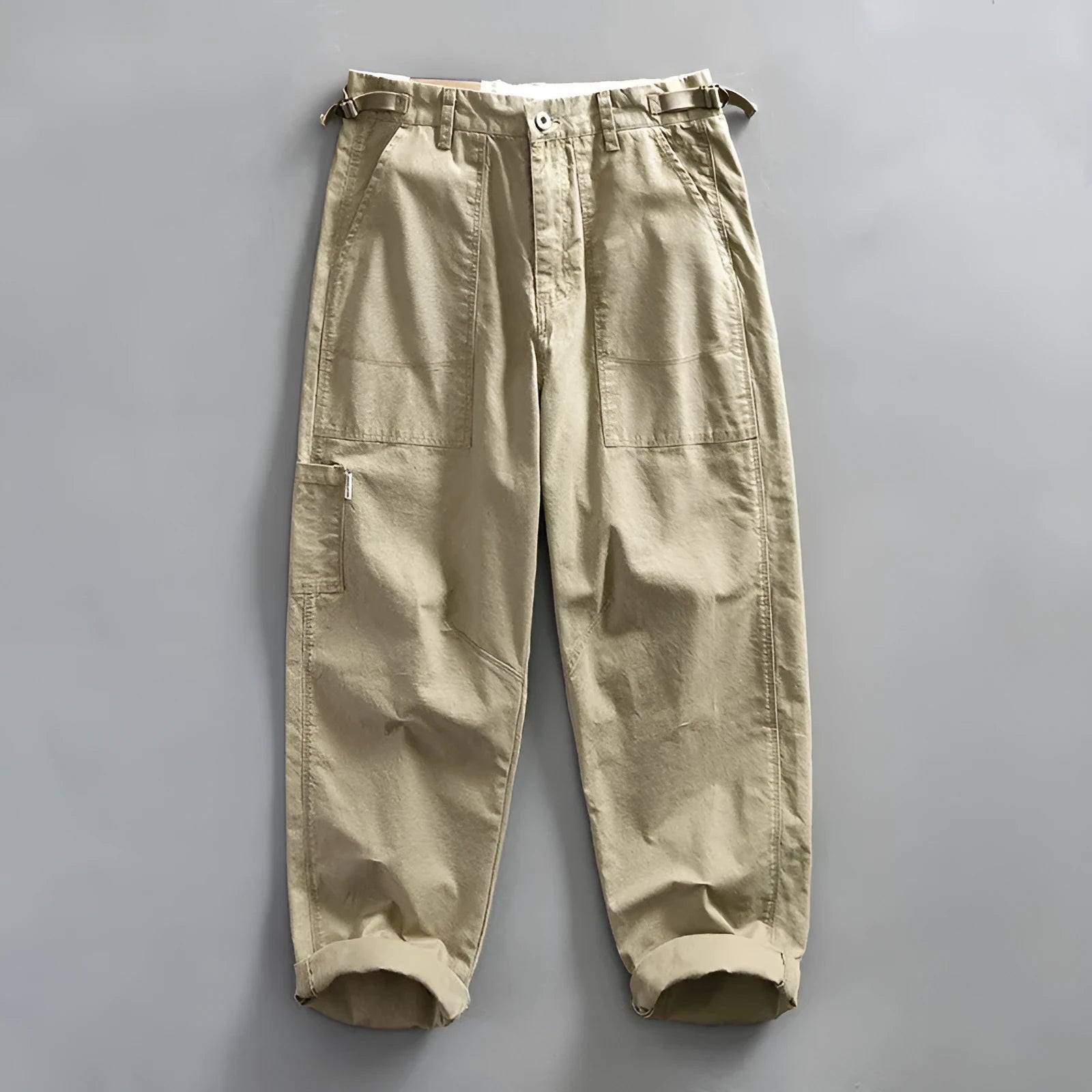 Men's straight fit cotton casual trousers in apricot, shown on a hanger.