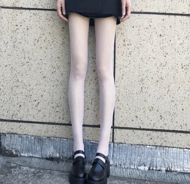 Women's black and white mesh stockings showing large, medium, and small net patterns in thin velvet polyester fabric.