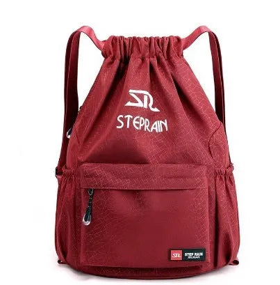 Lightweight solid colour Oxford cloth backpack with drawstring closure and double shoulder straps.