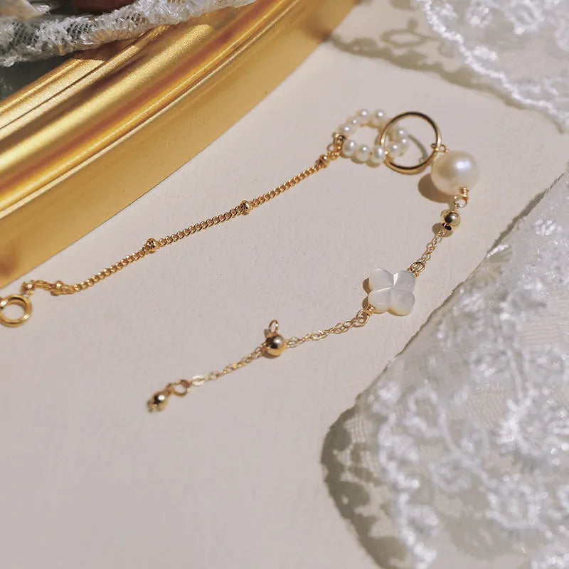Natural pearl women's bracelet with a 14k gold-plated setting on a single strand.