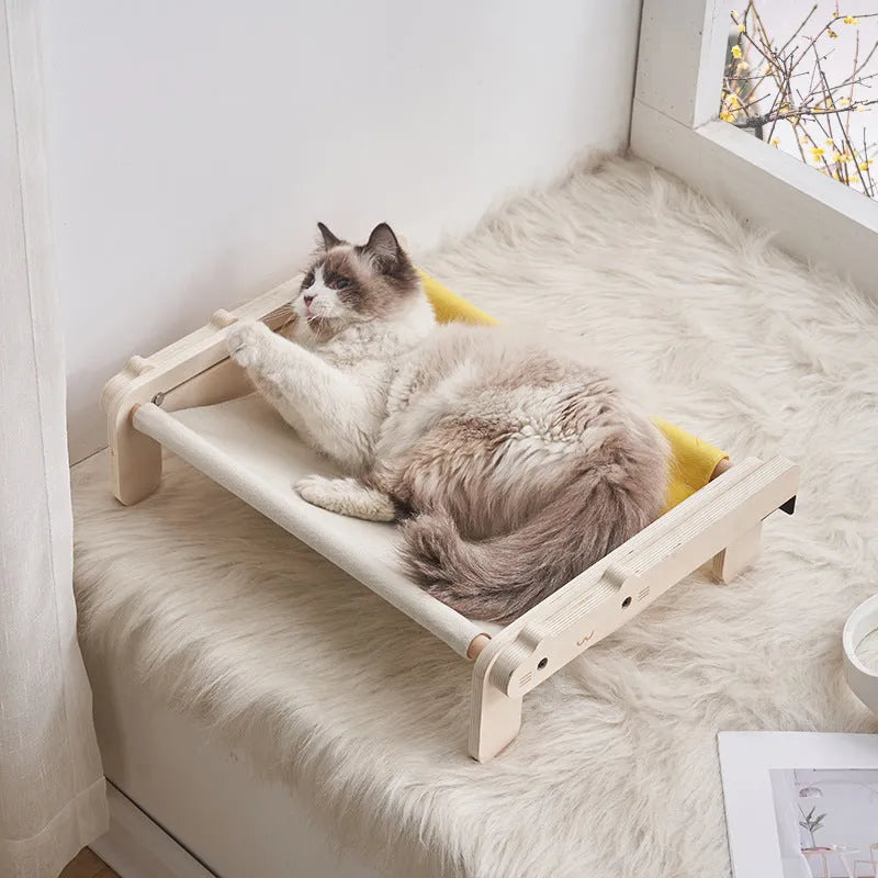 Solid wood cat bed with removable fabric in black and white plaid pattern