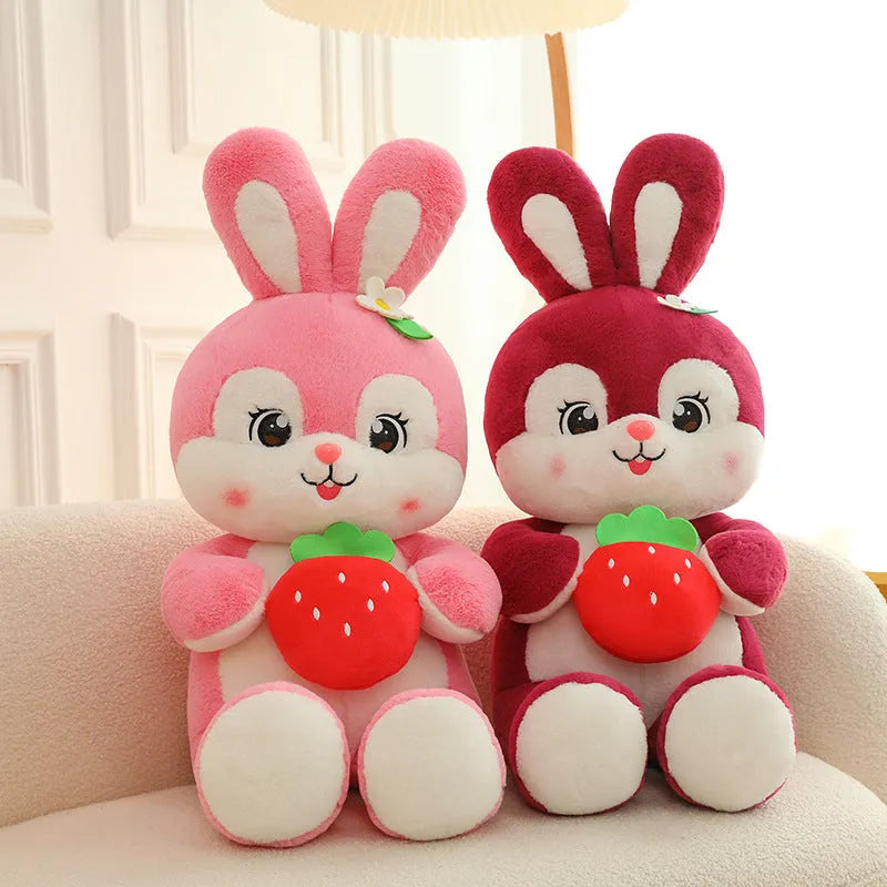 Cartoon strawberry rabbit plush toy doll pillow in pink sitting on a surface