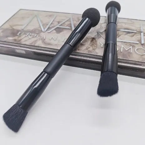Double-headed miter sponge concealer brush with black artificial fibre bristles on wooden handle