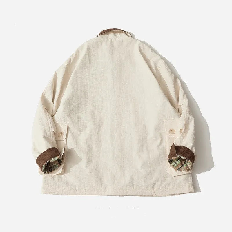 Green casual jacket with long sleeves and side seam pockets on a hanger