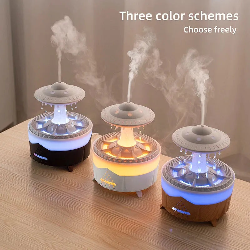 UFO cloud-shaped humidifier with LED lights and water droplet effects on dark surface