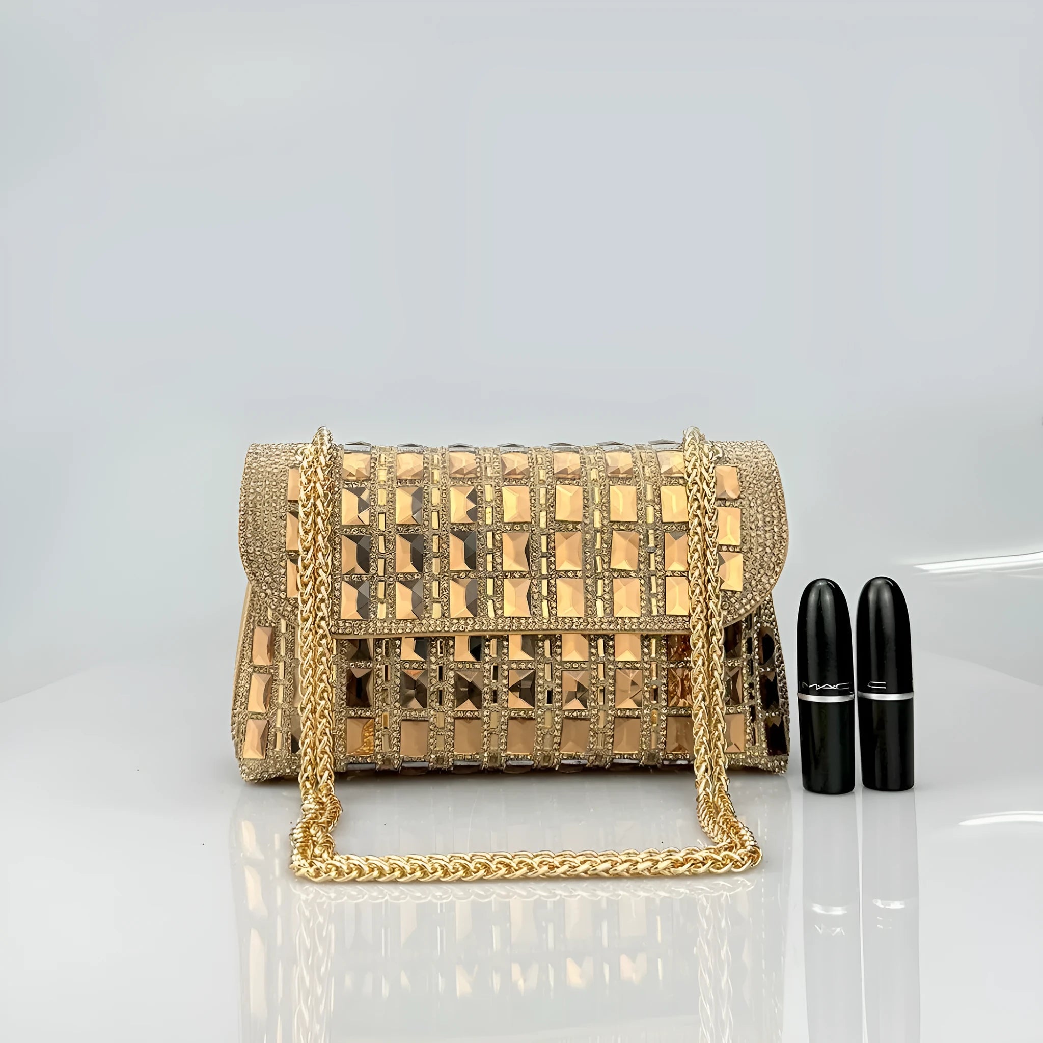 Silver rhinestone chain clutch purse with a horizontal square shape and open pocket.