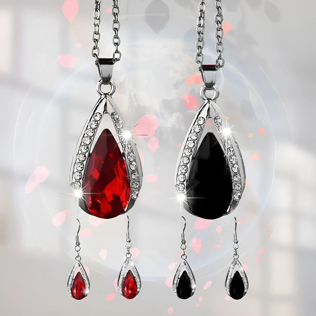 Black and red teardrop-shaped glass pendant necklace and matching earrings set on alloy chain.