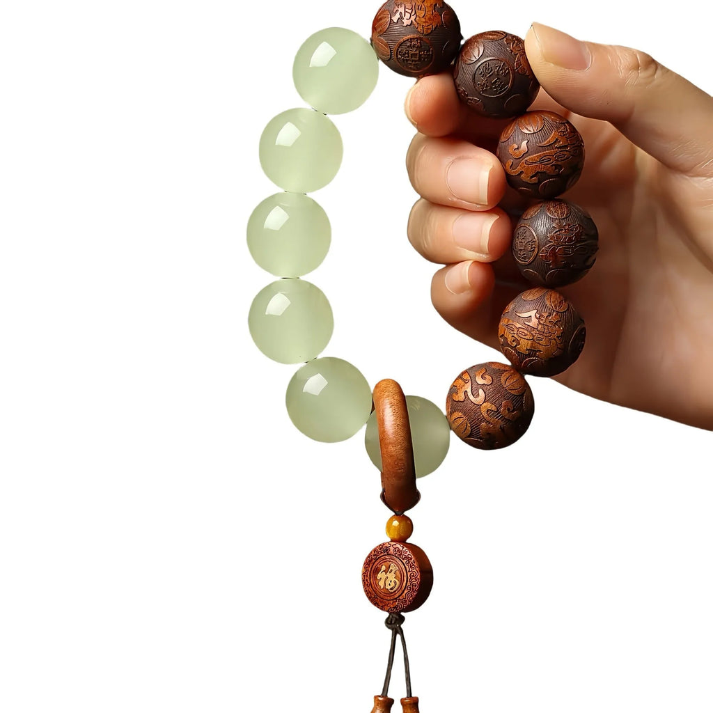 Rosewood flexible bracelet with fu character carving showing 20mm rings and amass fortunes colour finish