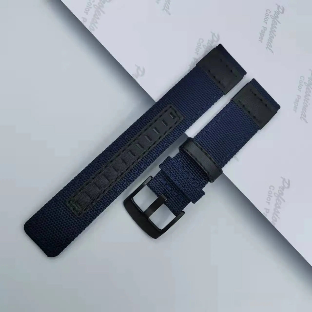 Oxford cloth watch strap in camouflage colour, showing textured fabric and metal buckle.