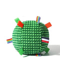 Blue and yellow textured rubber dog ball with holey lattice design, 17cm in diameter, on a wooden floor.