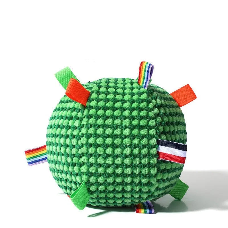 Blue and yellow textured rubber dog ball with holey lattice design, 17cm in diameter, on a wooden floor.