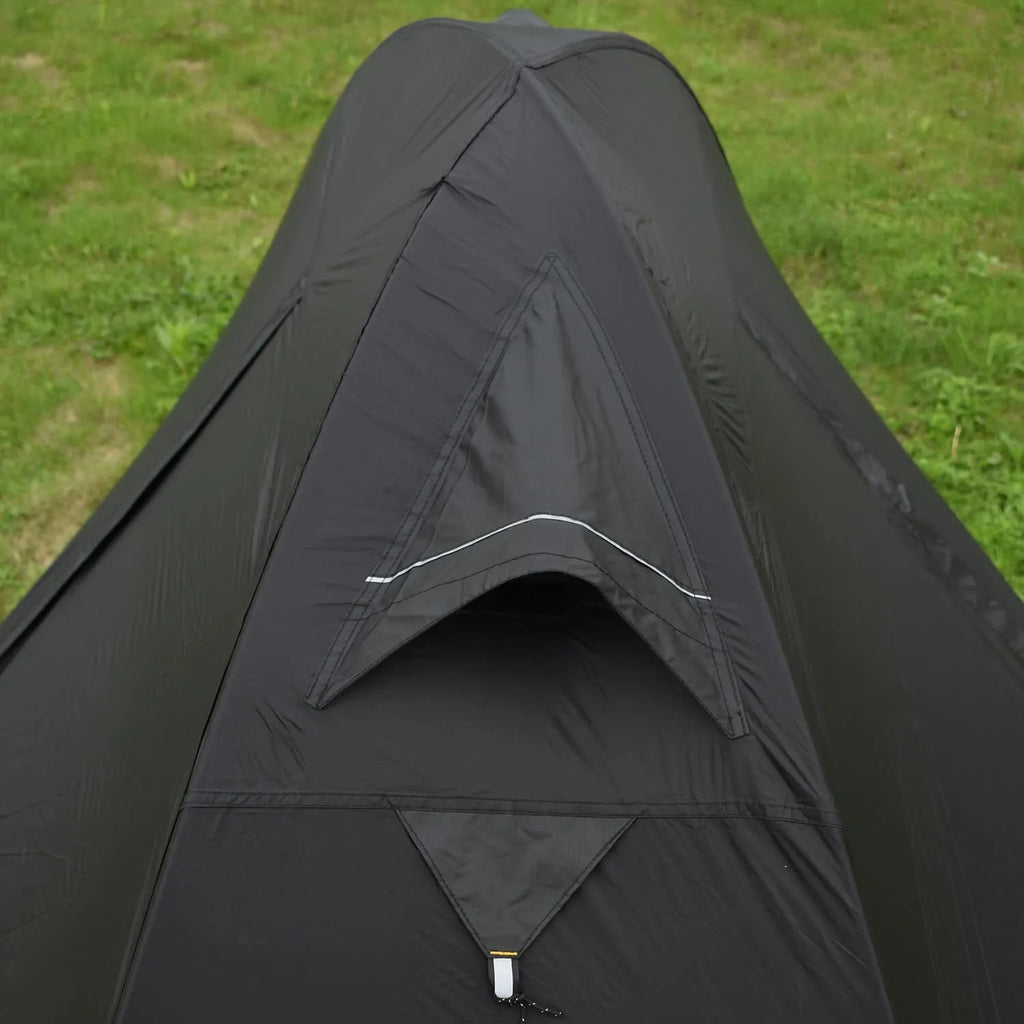 Single-person double-skin hiking tent in orange with aluminium poles, shown pitched in a field.