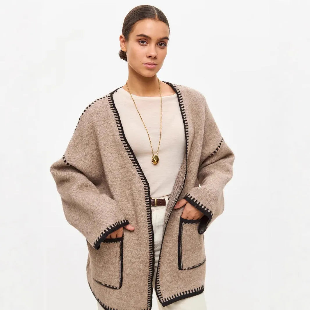 Loose lace-up knitted cardigan in camel colour, showing mid-length fit and long sleeves.