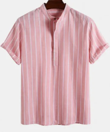 Man wearing a loose-fit printed polo shirt and trousers from the casual set, showing the letter graphic detail.