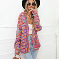 Rose red loose fit short cardigan coat with rainbow striped pattern on a hanger.