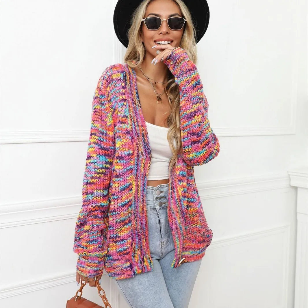 Rose red loose fit short cardigan coat with rainbow striped pattern on a hanger.