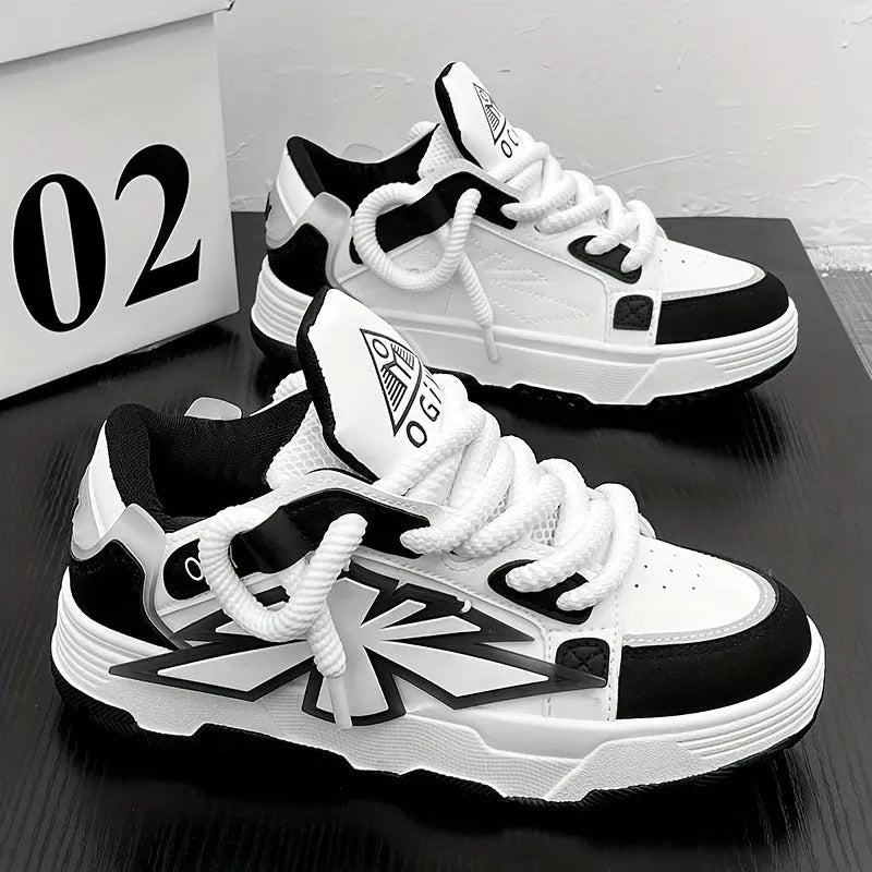 Men's white chunky sneakers with cartoon pattern, thick rubber sole, and front lace-up design on a plain background.