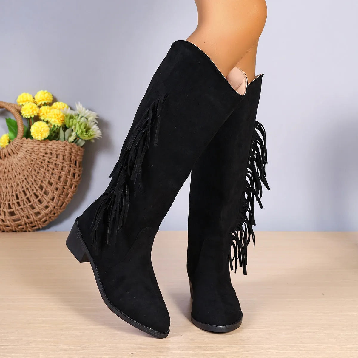 Women's brown fringe chunky heel long western boots with tassel detail and pointed toe