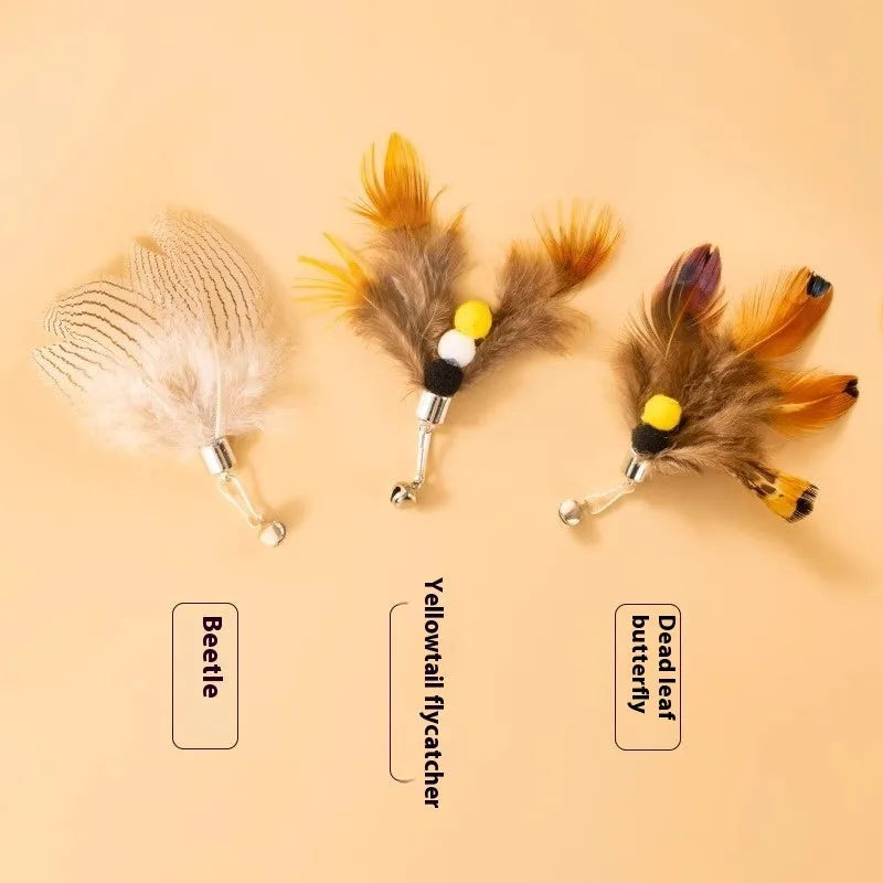 Three steel wire cat toy replacement heads shaped like small flying insects on a white background